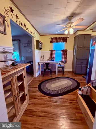 a room with stainless steel appliances granite countertop a stove a sink and a refrigerator