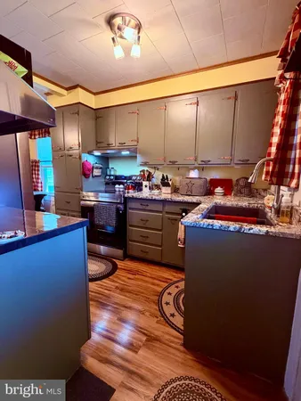 a kitchen with sink cabinets and outdoor view