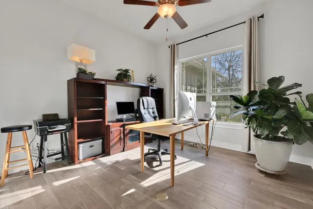 a dining room with furniture and wooden floor
