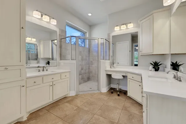 a spacious bedroom with a large bed and a window