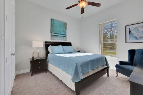 a spacious bathroom with a shower sink double and mirror