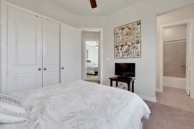 a bedroom with a bed and a lamp