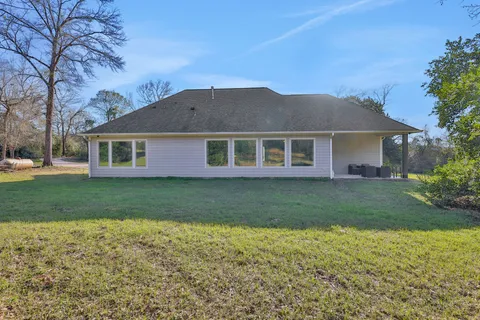 a bathroom with a sink mirror vanity and toilet