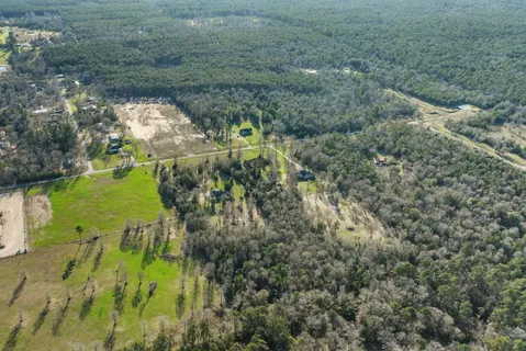 a view of a yard with swimming pool