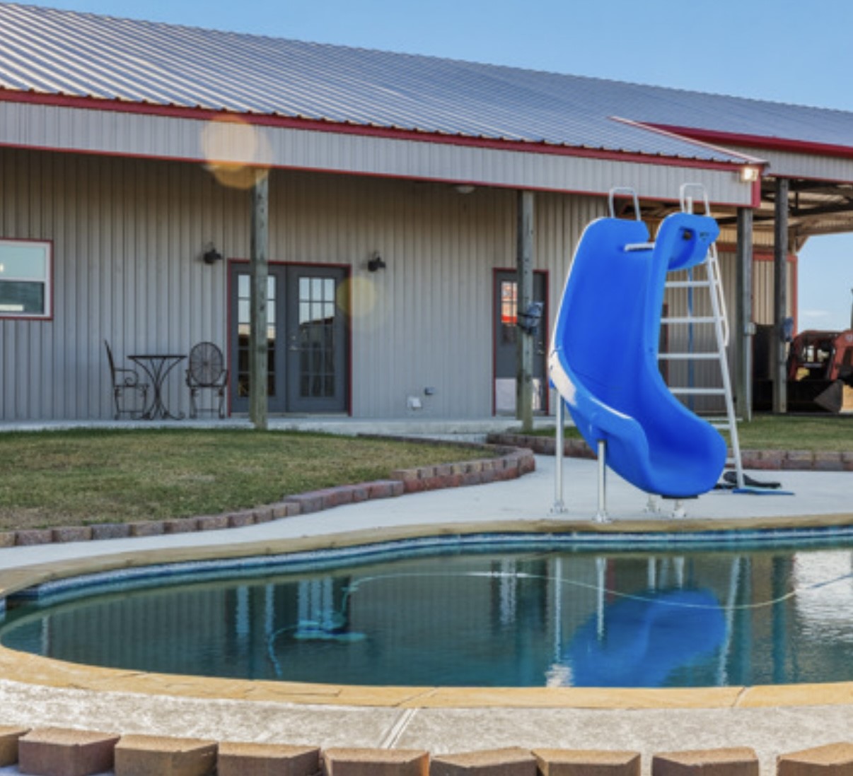 7210 Goehring Road Ledbetter, TX 78946 - Photo 27 of 47 a view of swimming pool with outdoor seating