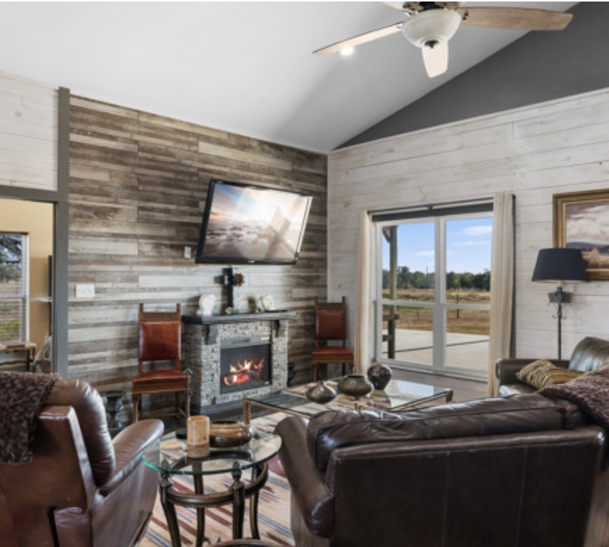 7210 Goehring Road Ledbetter, TX 78946 - Photo 9 of 47 a room with furniture a flat screen tv and a fireplace