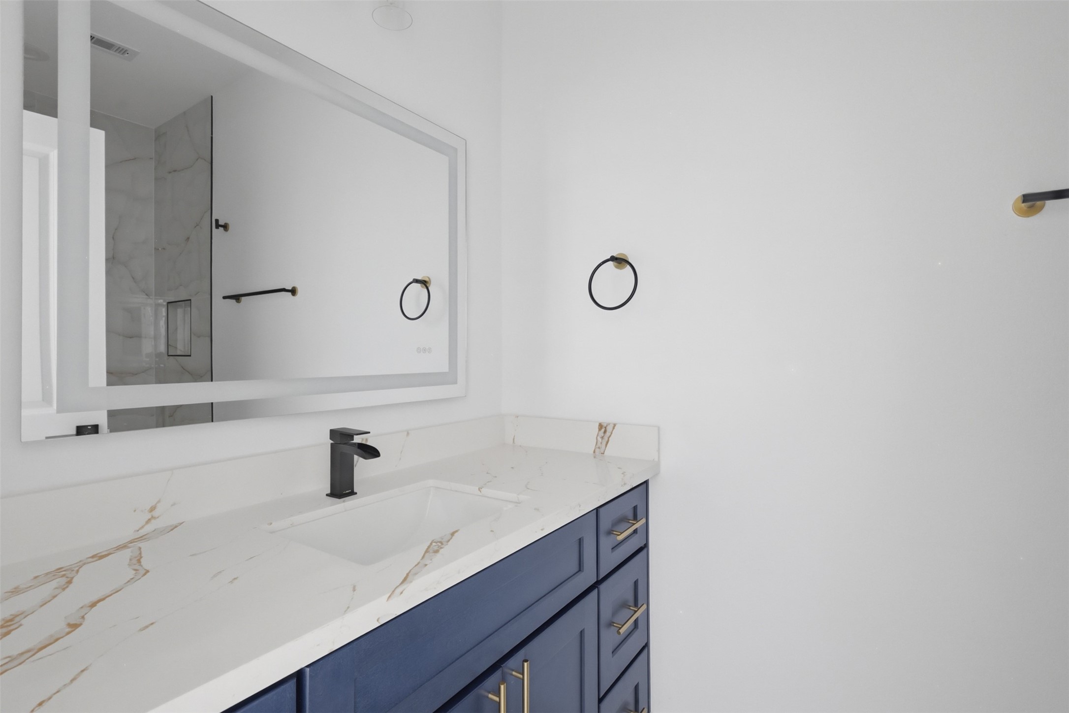 4606 Mallow Street, Unit B Houston, TX 77051 - Photo 15 of 25 a bathroom with a sink and a mirror