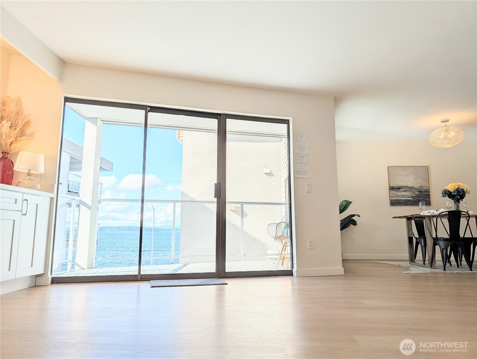 2104 Alki Avenue Southwest, Unit 306 Seattle, WA 98116 - Photo 14 of 40 a view of an empty room with wooden floor and a window