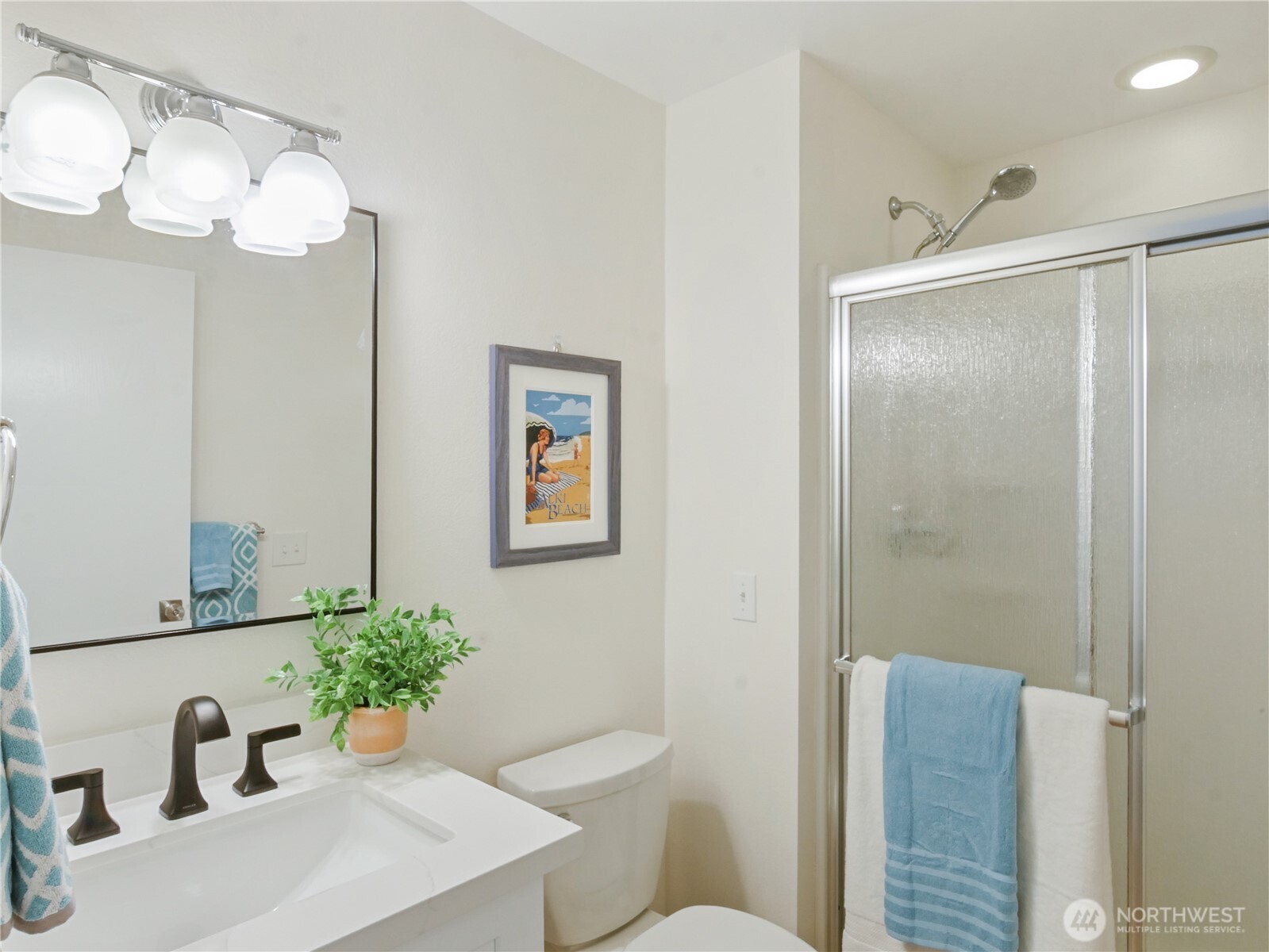 2104 Alki Avenue Southwest, Unit 306 Seattle, WA 98116 - Photo 25 of 40 a bathroom with a sink toilet and shower