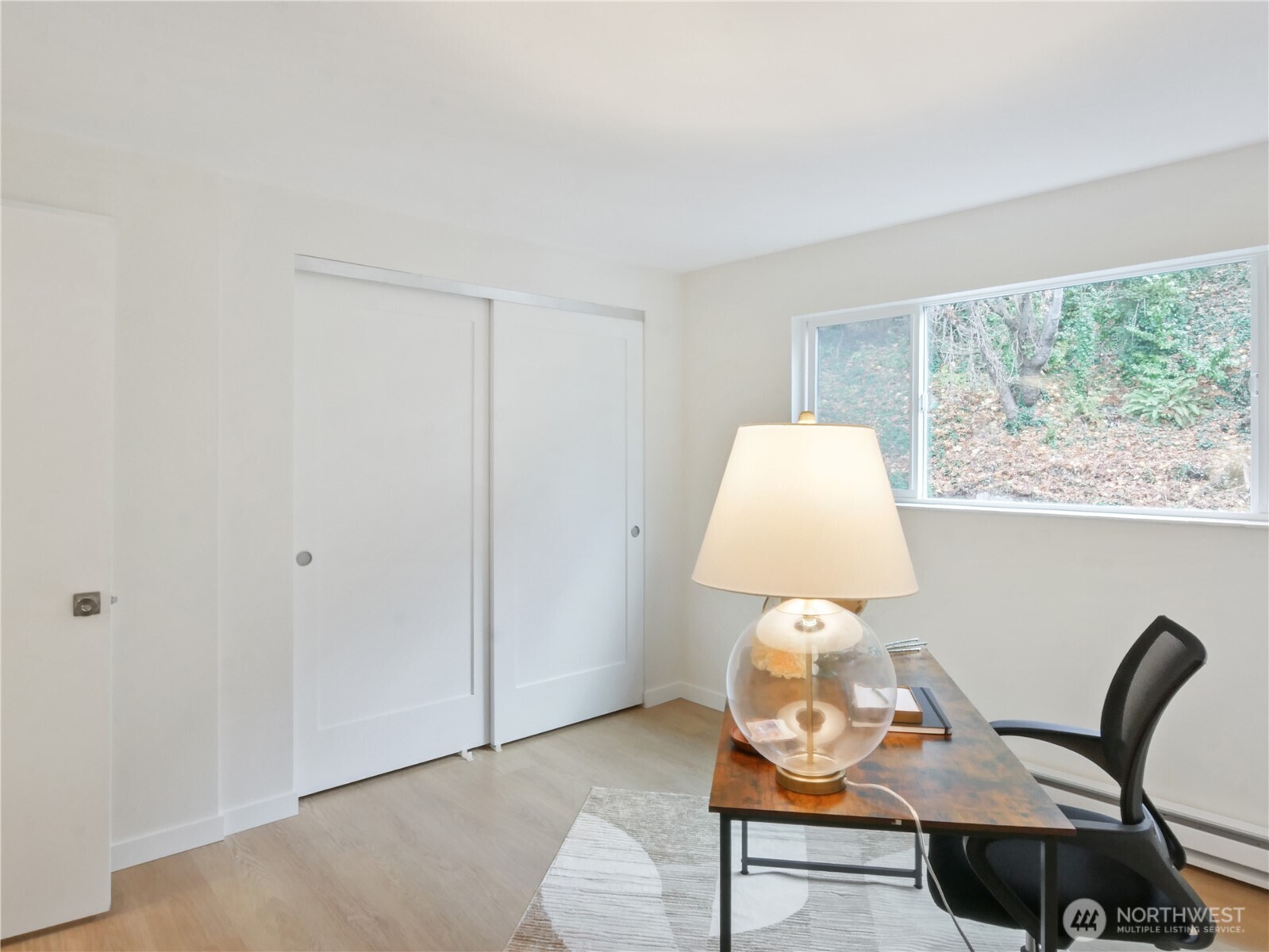 2104 Alki Avenue Southwest, Unit 306 Seattle, WA 98116 - Photo 27 of 40 a room with furniture and window