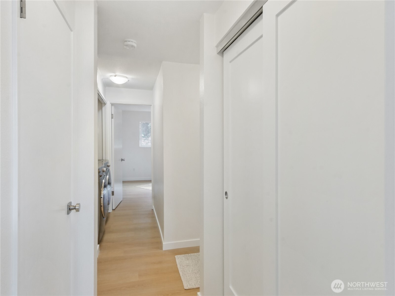 2104 Alki Avenue Southwest, Unit 306 Seattle, WA 98116 - Photo 28 of 40 a bathroom with a glass shower door