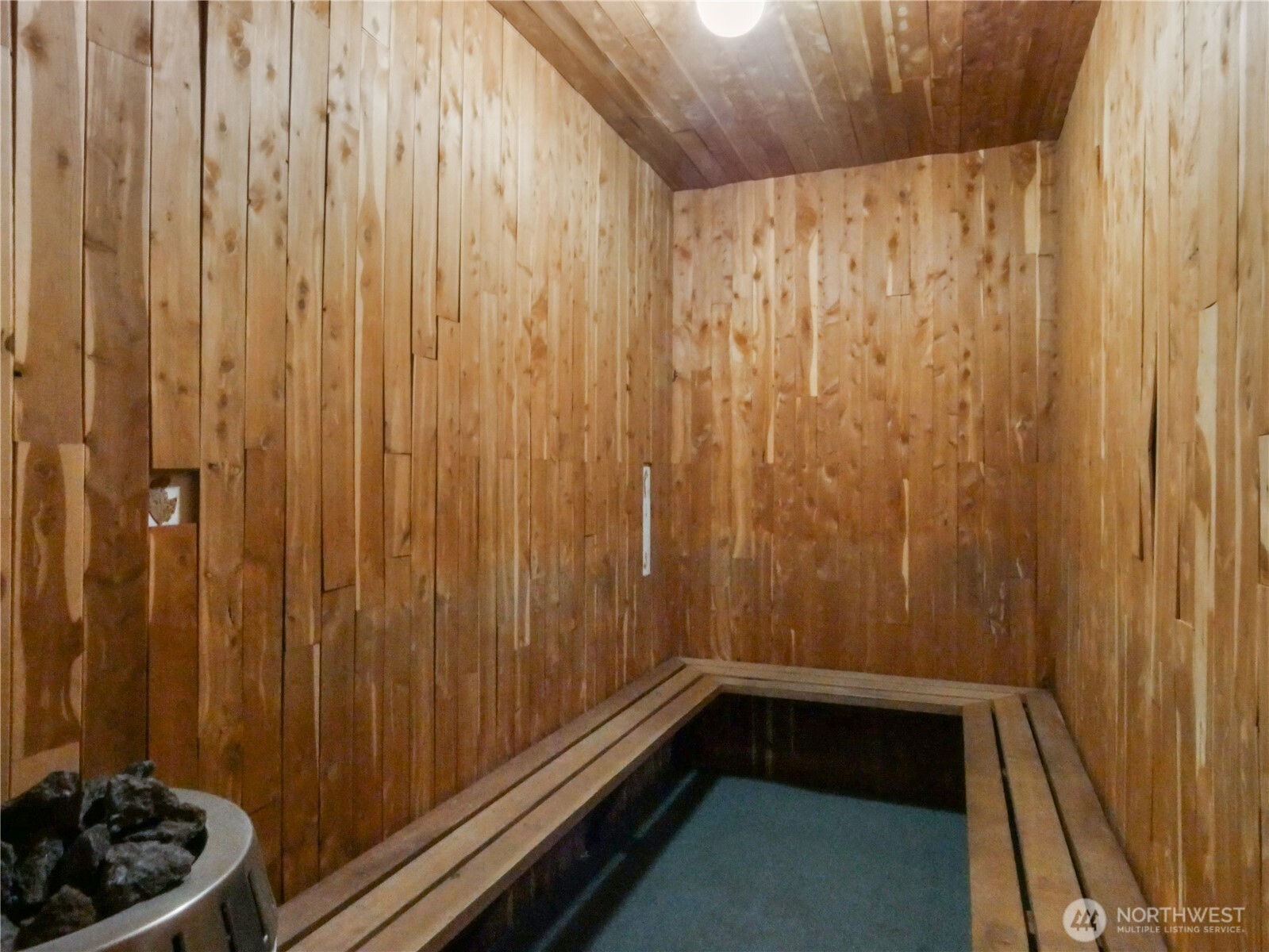 2104 Alki Avenue Southwest, Unit 306 Seattle, WA 98116 - Photo 34 of 40 a bathroom with a toilet and shower curtain