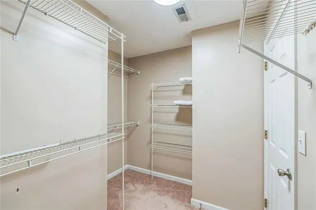 a view of an empty walk in closet