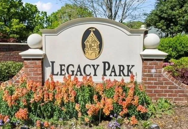 a view of sign board with flower around