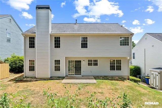 a view of a house with snow on the road