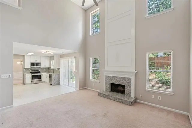 a view of a livingroom with furniture and a fireplace