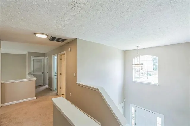 a spacious bathroom with a bathtub and shower
