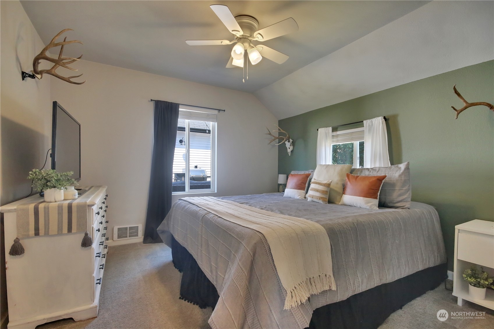 263 Perkins Street Buckley, WA 98321 - Photo 12 of 21 a bedroom with a bed and a chandelier