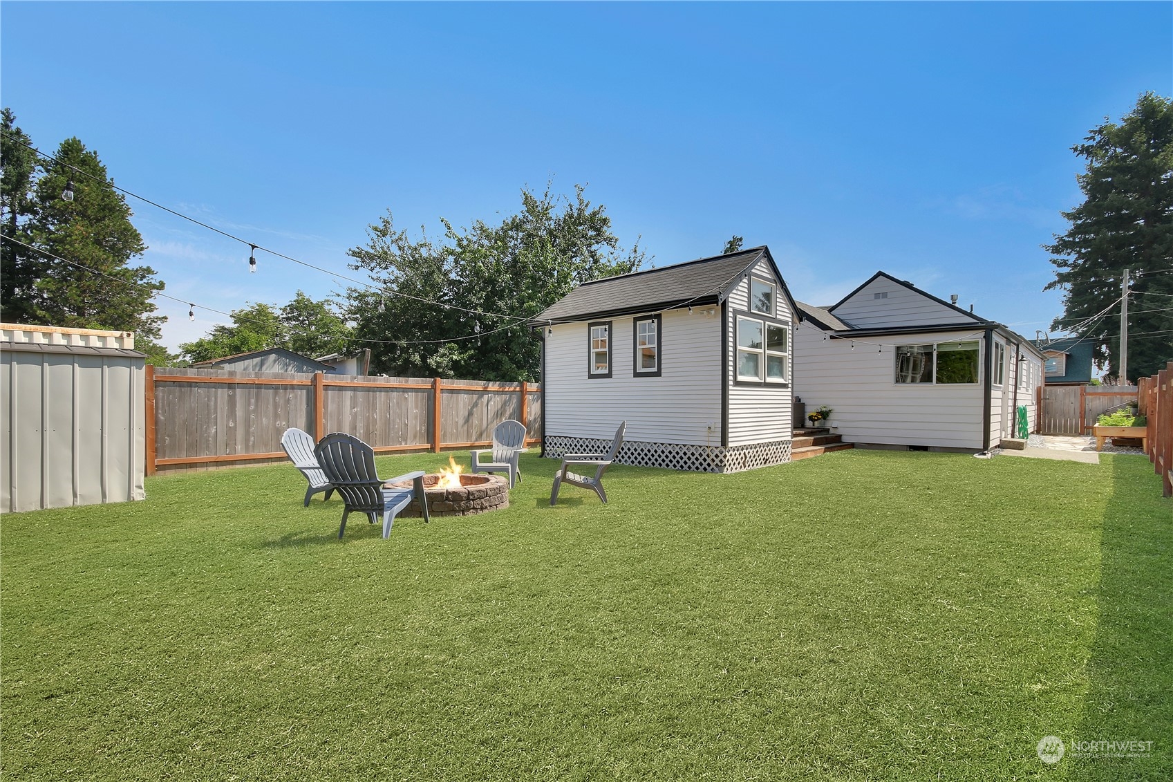 263 Perkins Street Buckley, WA 98321 - Photo 19 of 21 a backyard of a house with table and chairs