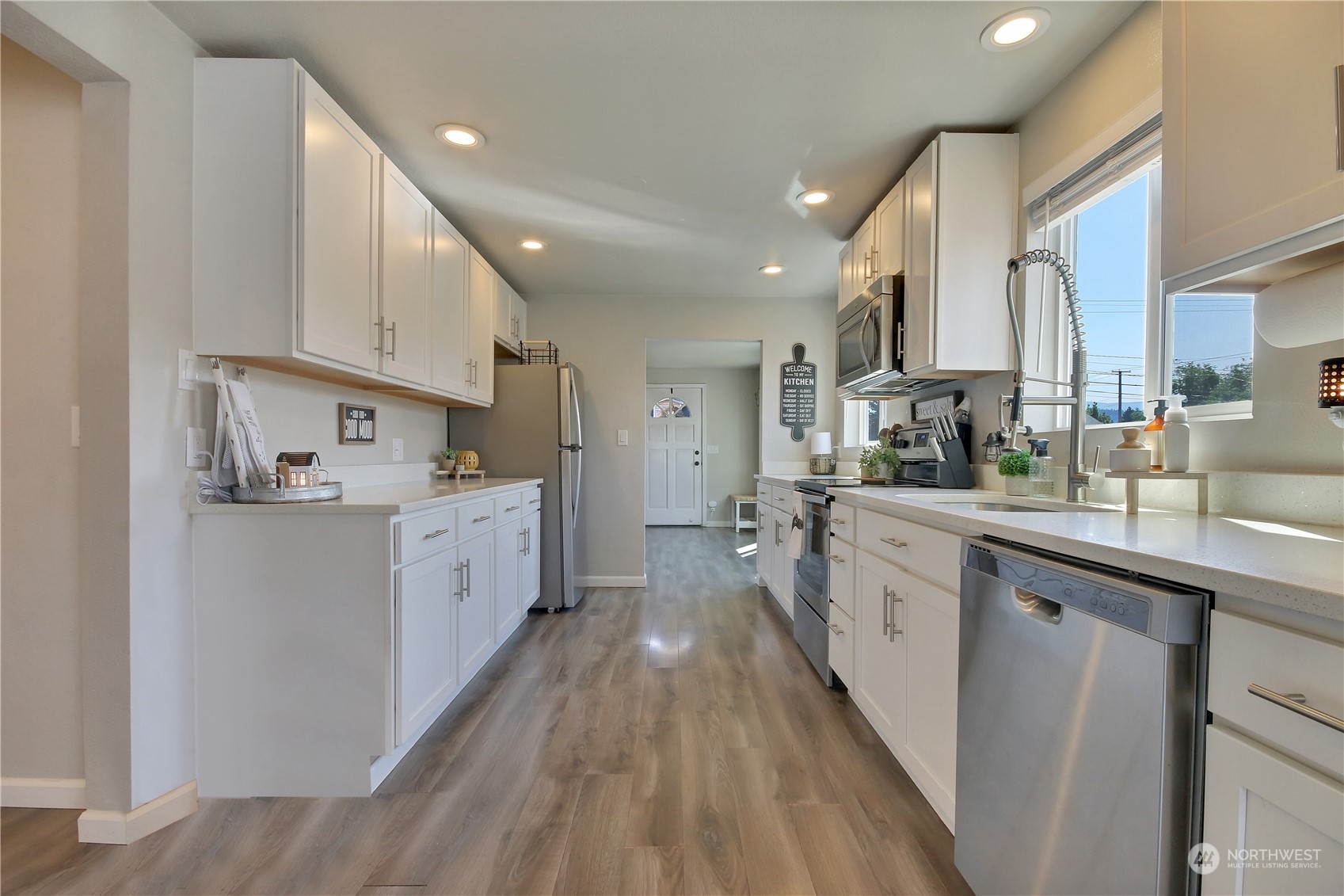 263 Perkins Street Buckley, WA 98321 - Photo 8 of 21 a kitchen with white cabinets appliances and sink