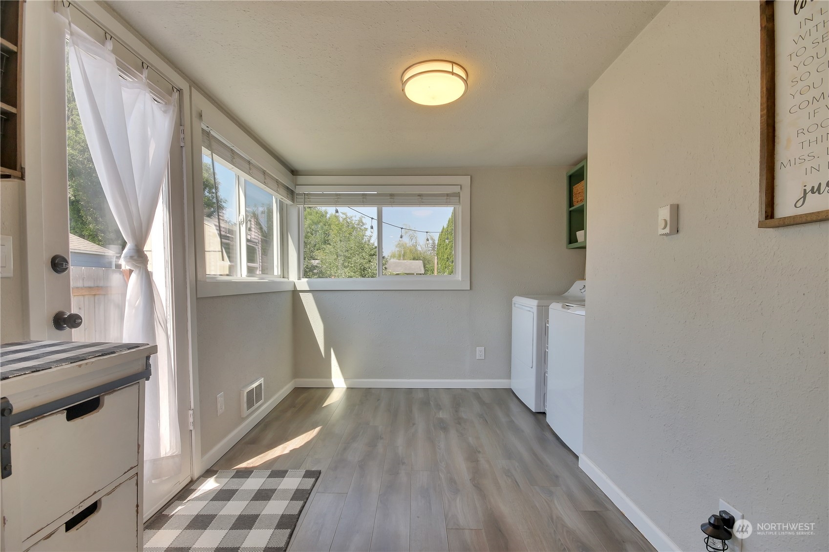 263 Perkins Street Buckley, WA 98321 - Photo 10 of 21 a view of empty room with wooden floor and fan