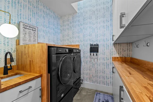 a bathroom with a sink and mirror