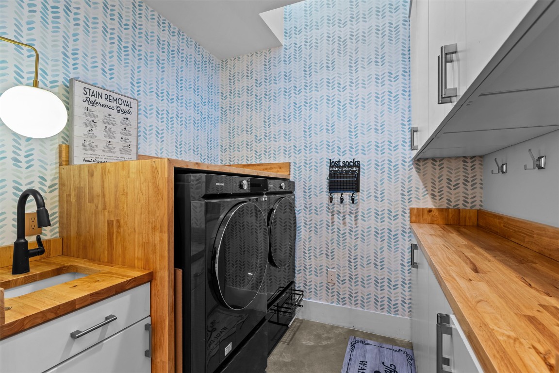 5704 Driftwood Drive Austin, TX 78731 - Photo 14 of 40 a bathroom with a sink and mirror