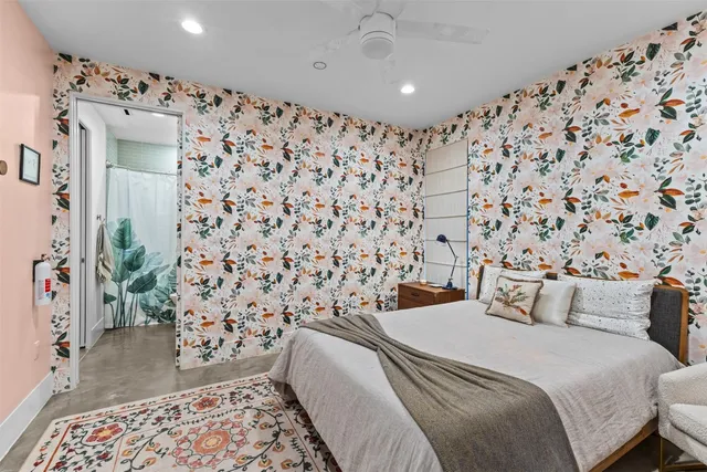 a bedroom with a bed and a curtain