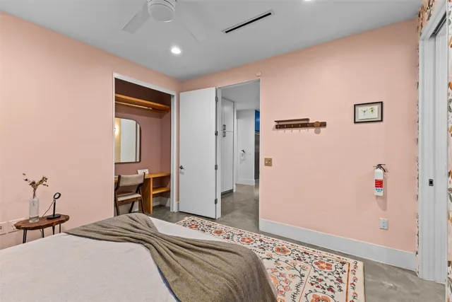 a bedroom with a bed and a dresser