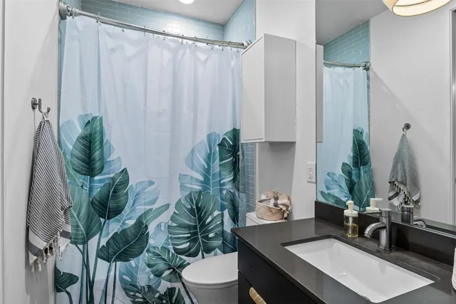 a view of a flower pot on a table and a chair