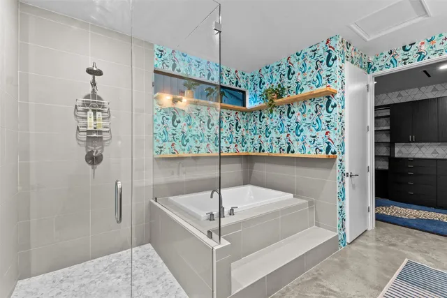 a bathroom with a double vanity sink and a large mirror