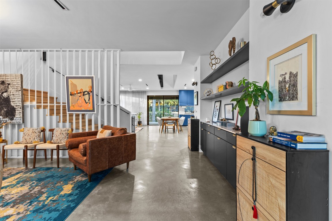5704 Driftwood Drive Austin, TX 78731 - Photo 2 of 40 a living room with fireplace furniture and a large window
