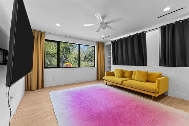 a room with furniture and a potted plant