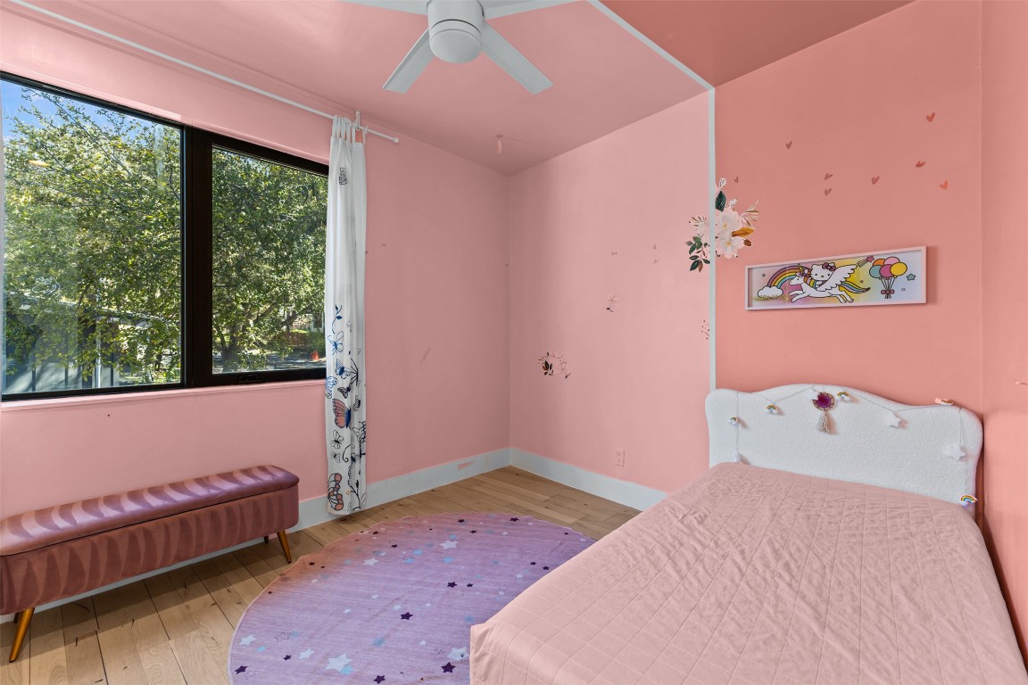 5704 Driftwood Drive Austin, TX 78731 - Photo 30 of 40 a bedroom with a bed and a window