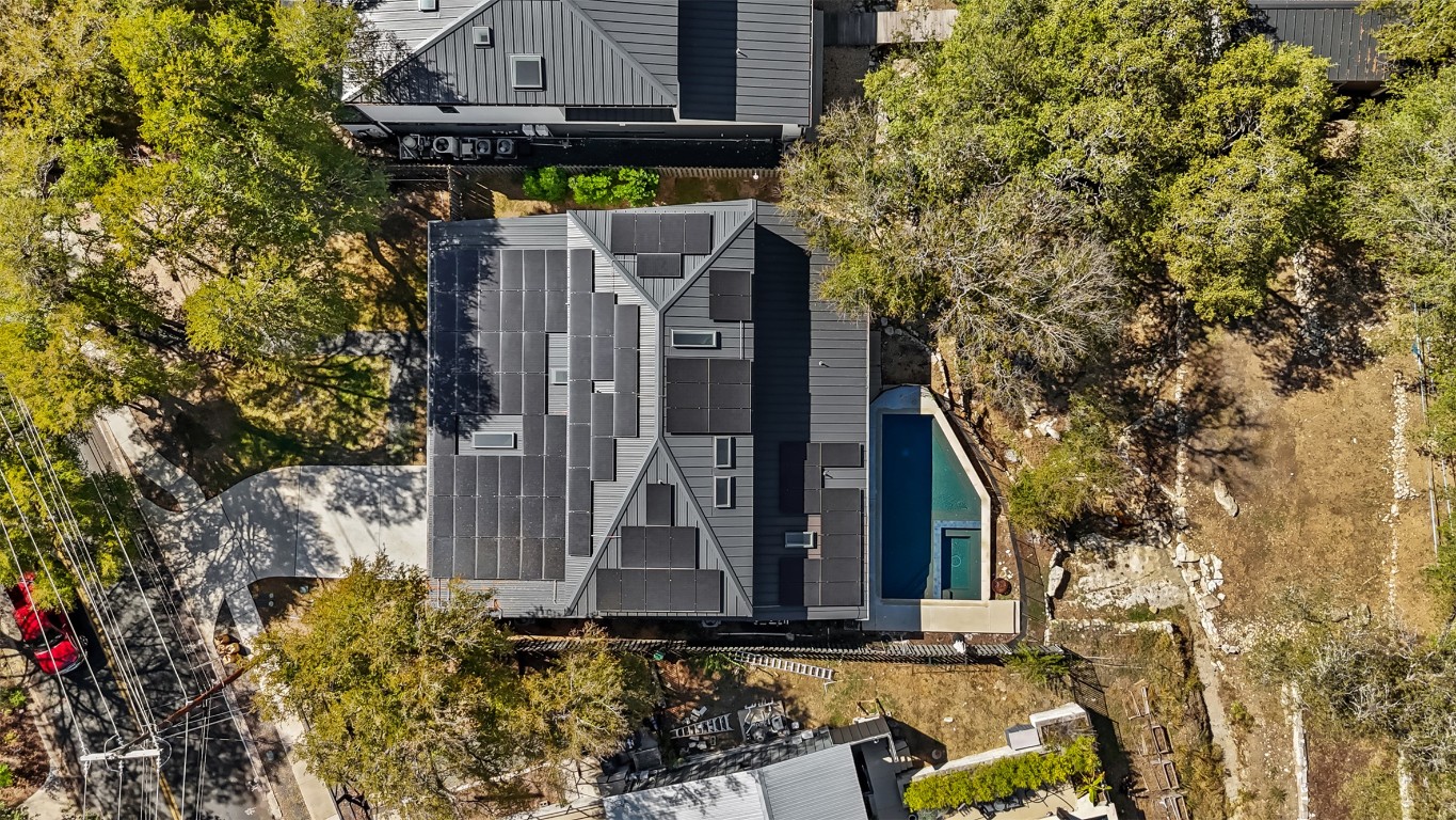 5704 Driftwood Drive Austin, TX 78731 - Photo 39 of 40 a view of a house with brick wall and potted plants