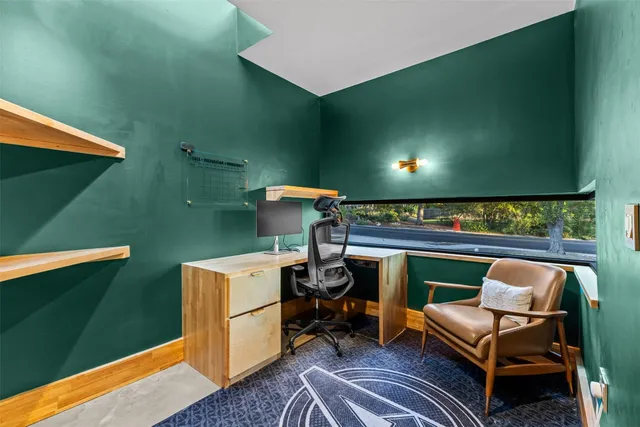 a view of a chairs and table in a room