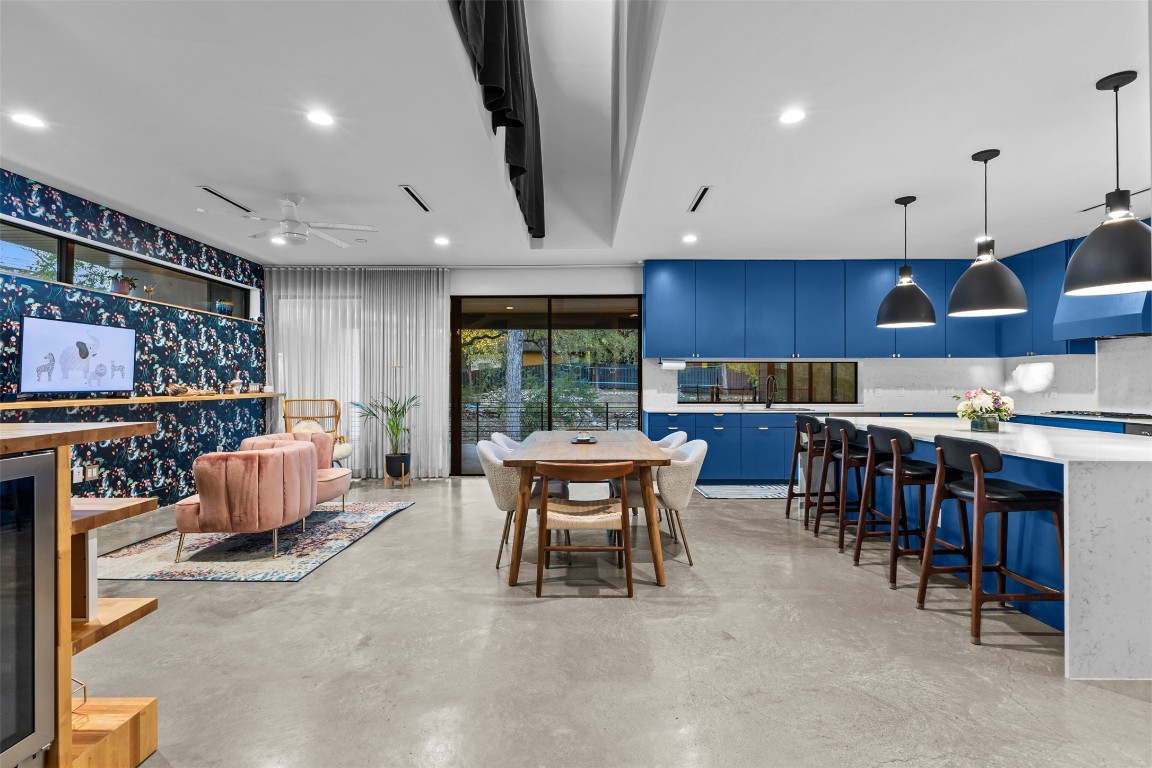 5704 Driftwood Drive Austin, TX 78731 - Photo 8 of 40 a dining room with furniture and a large window