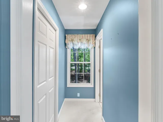 a view of a hallway with windows