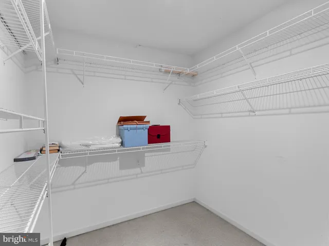 a view of storage and utility room with racks on the wall