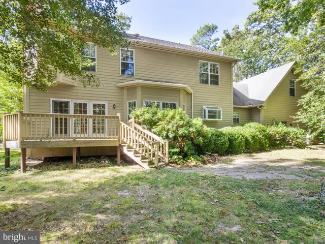 a house that has a big yard in front of it
