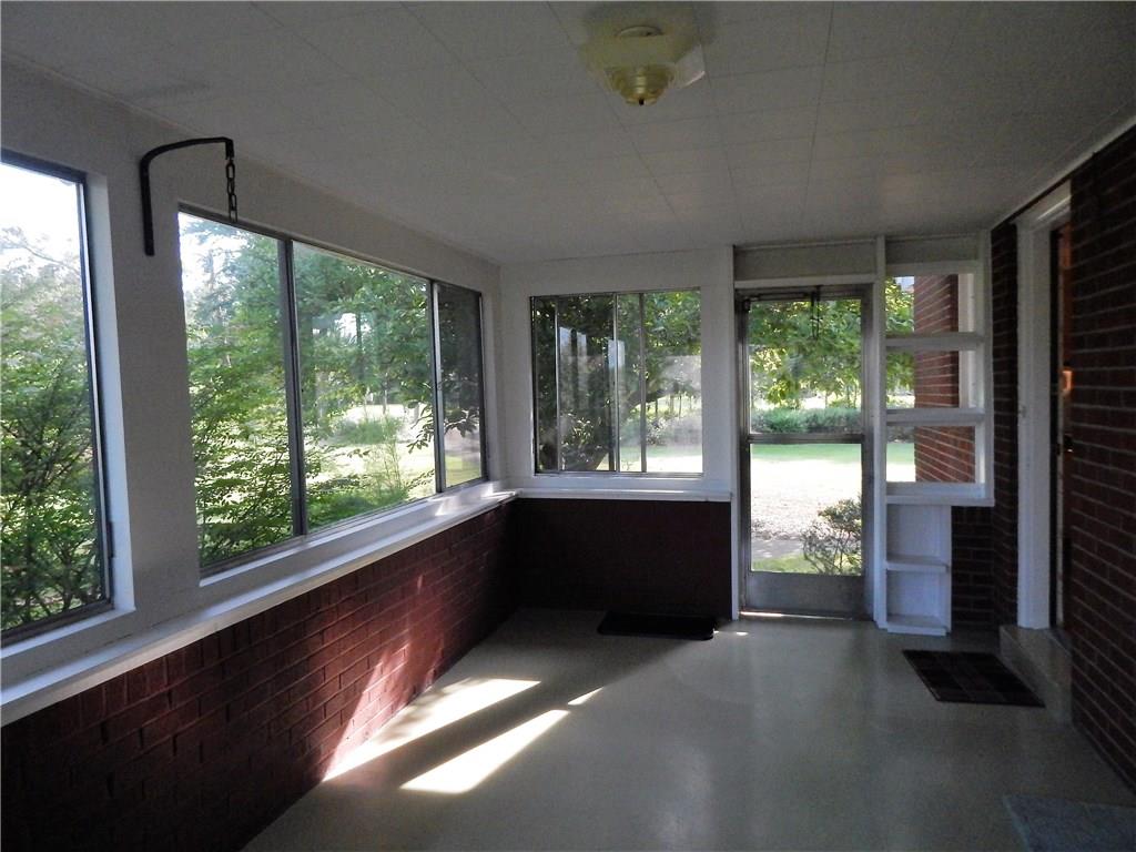 2513 Haymaker Road Monroeville, PA 15146 - Photo 8 of 21 ENCLOSED PORCH WITH DOOR LEADINGTO THE SIDE YARD.