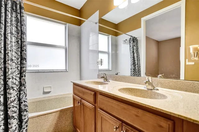 a view of a kitchen with furniture and staircase