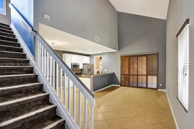 a kitchen with stainless steel appliances a stove sink and cabinets