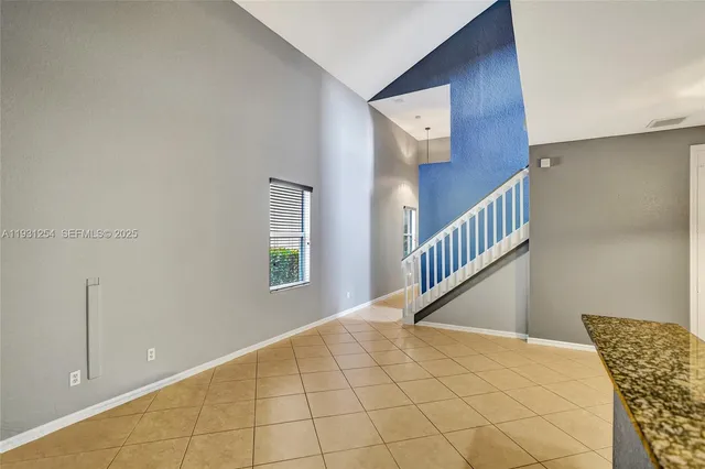 a kitchen with stainless steel appliances granite countertop a stove and a sink