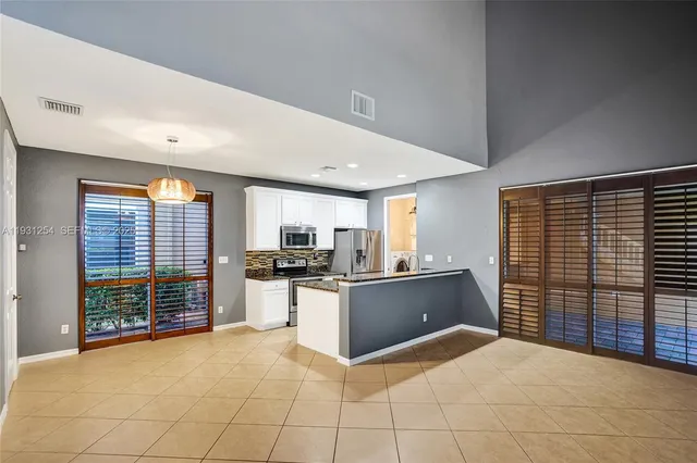 a kitchen with a stove a sink and a microwave