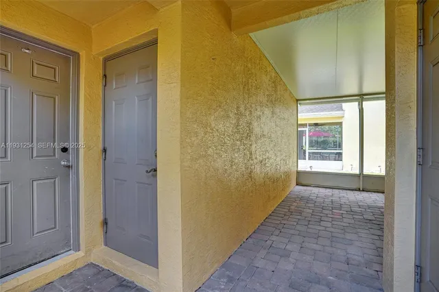 a view of hallway with wooden floor