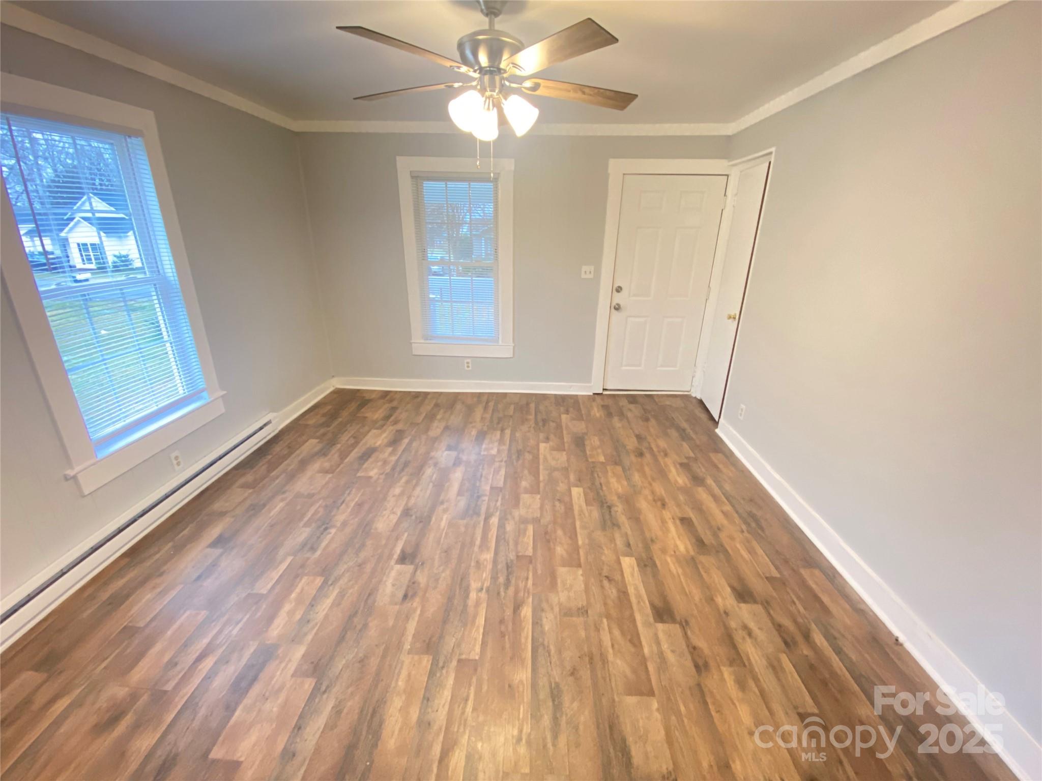 907 Indiana Street Kannapolis, NC 28083 - Photo 13 of 19 wooden floor in an empty room with a window