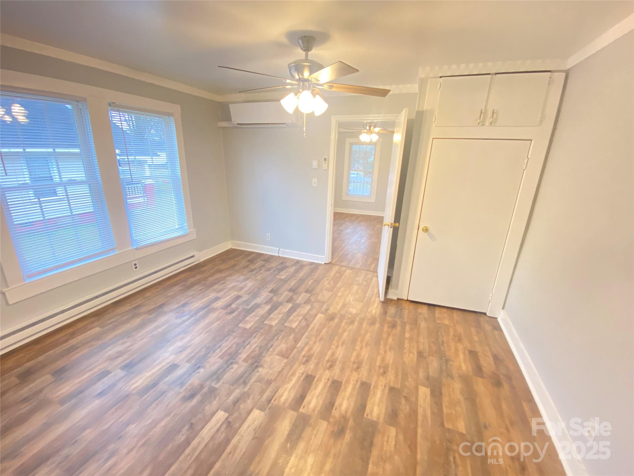 907 Indiana Street Kannapolis, NC 28083 - Photo 14 of 19 a view of livingroom with hardwood floor and window