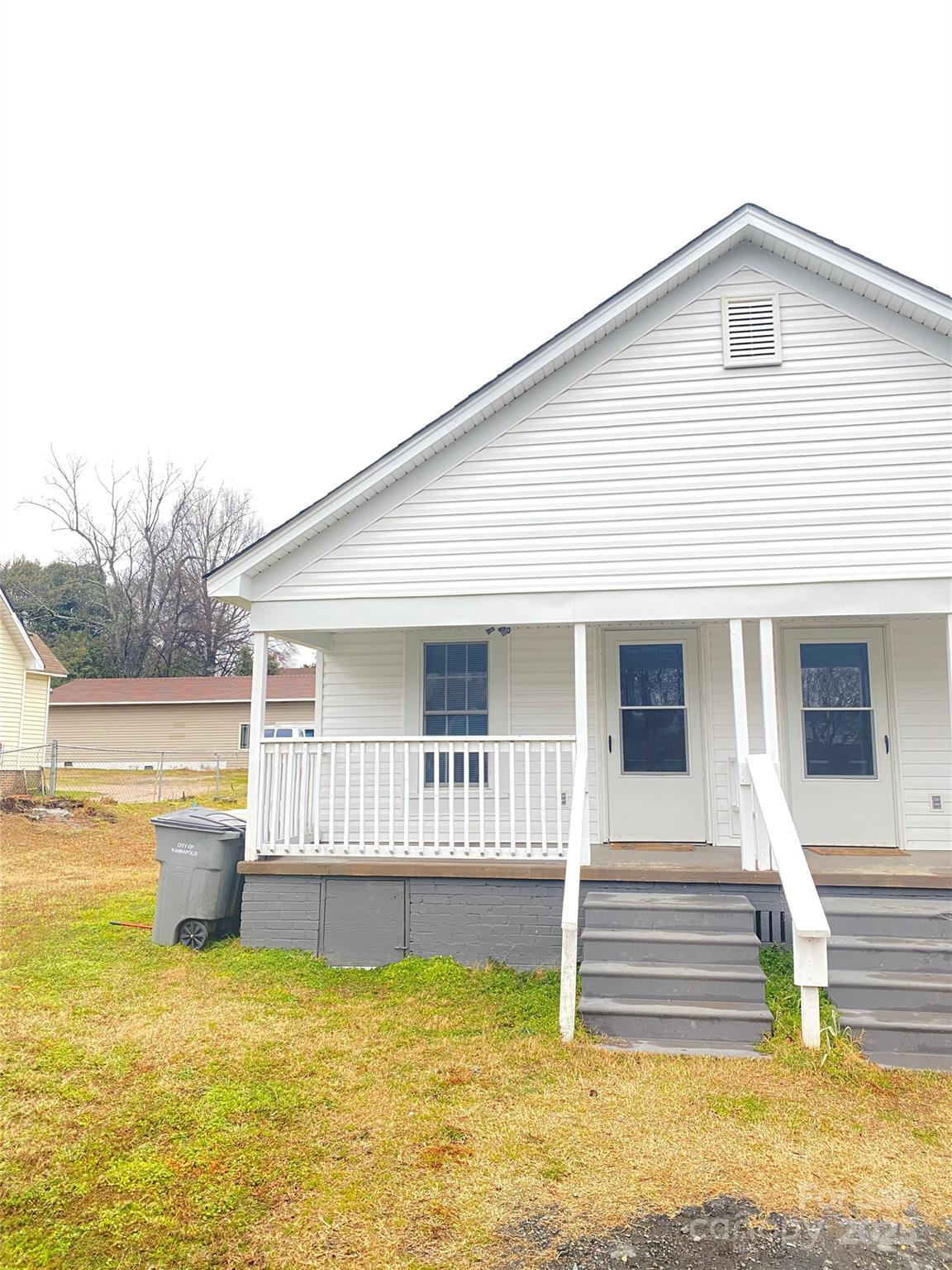 907 Indiana Street Kannapolis, NC 28083 - Photo 2 of 19 a front view of a house with a swimming pool