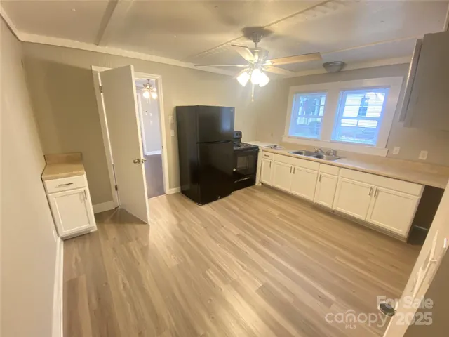 a large bathroom with a sink a large mirror and a shower